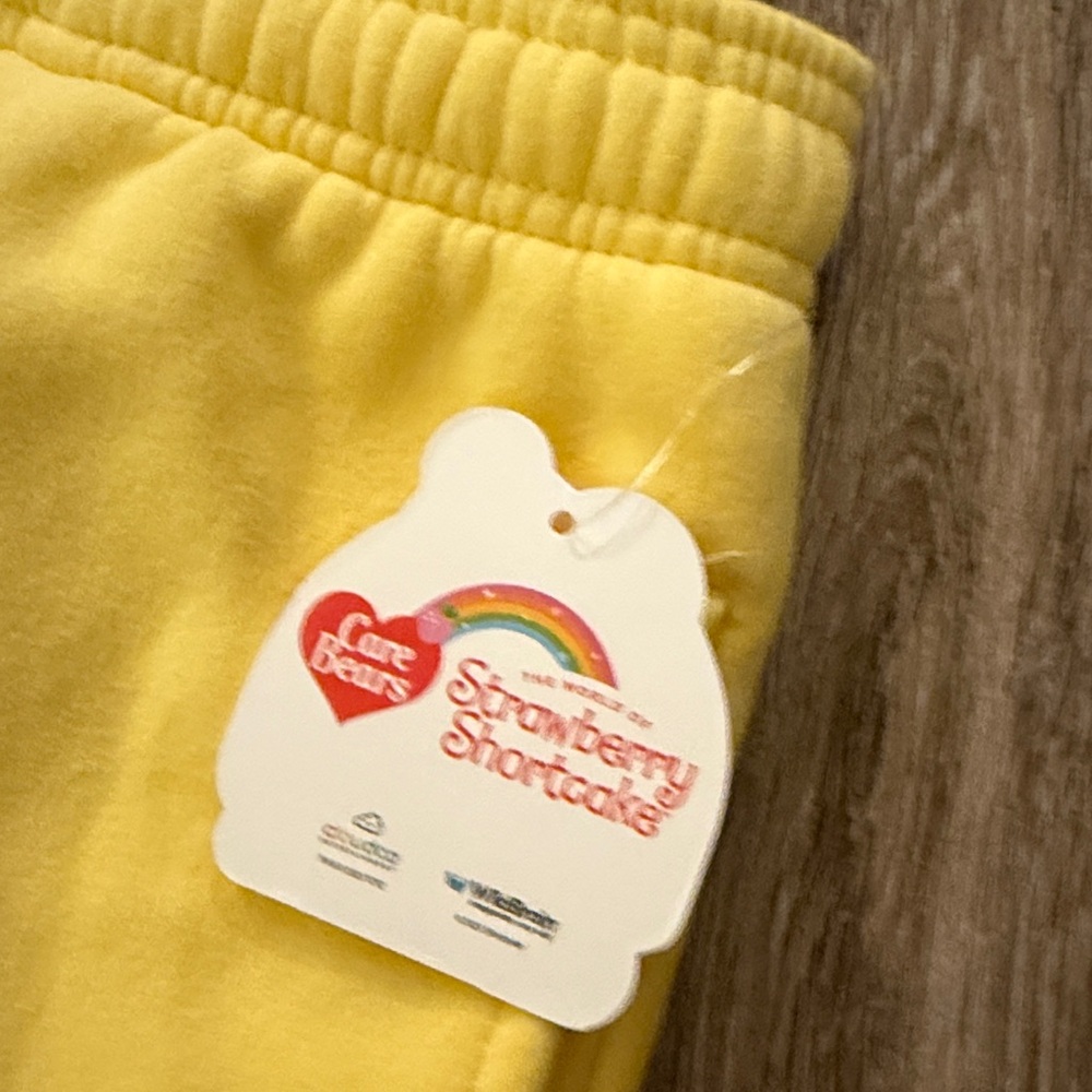 NWT L Samii Ryan Care Bears & Strawberry Shortcake Offer Kindness Yellow Joggers - Picture 9 of 10